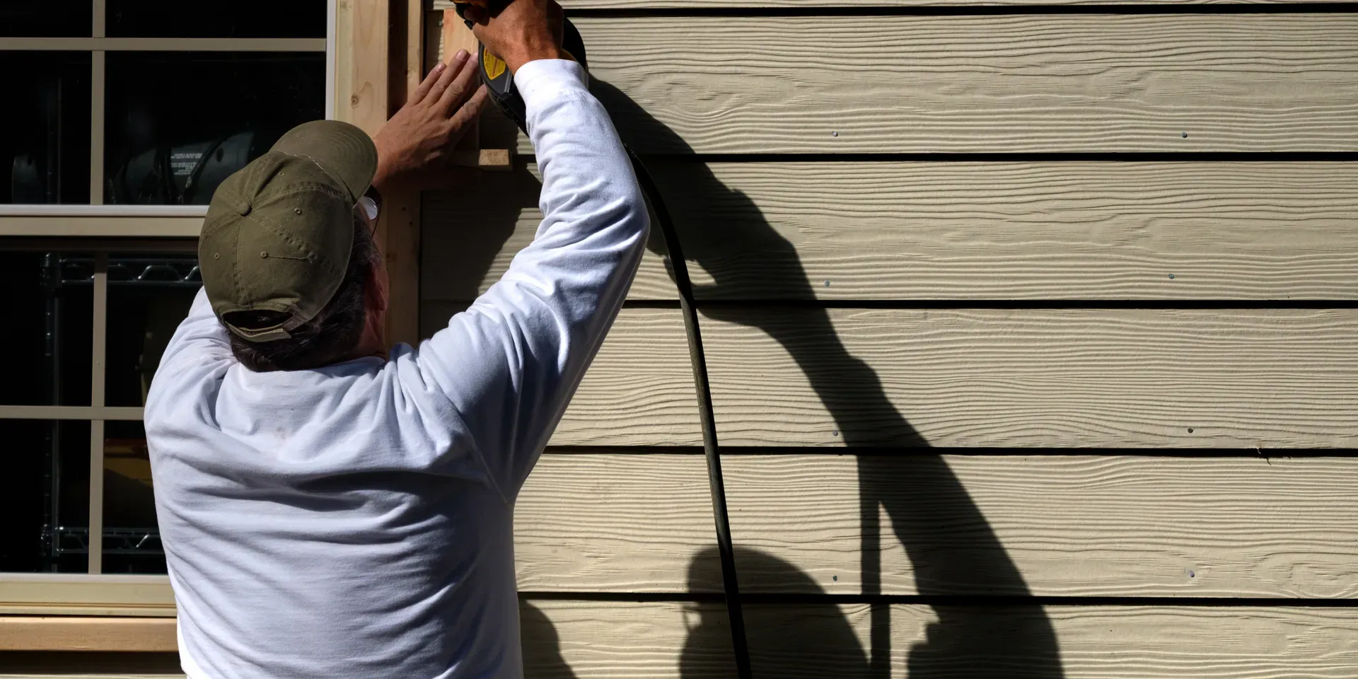 new vinyl siding being installed